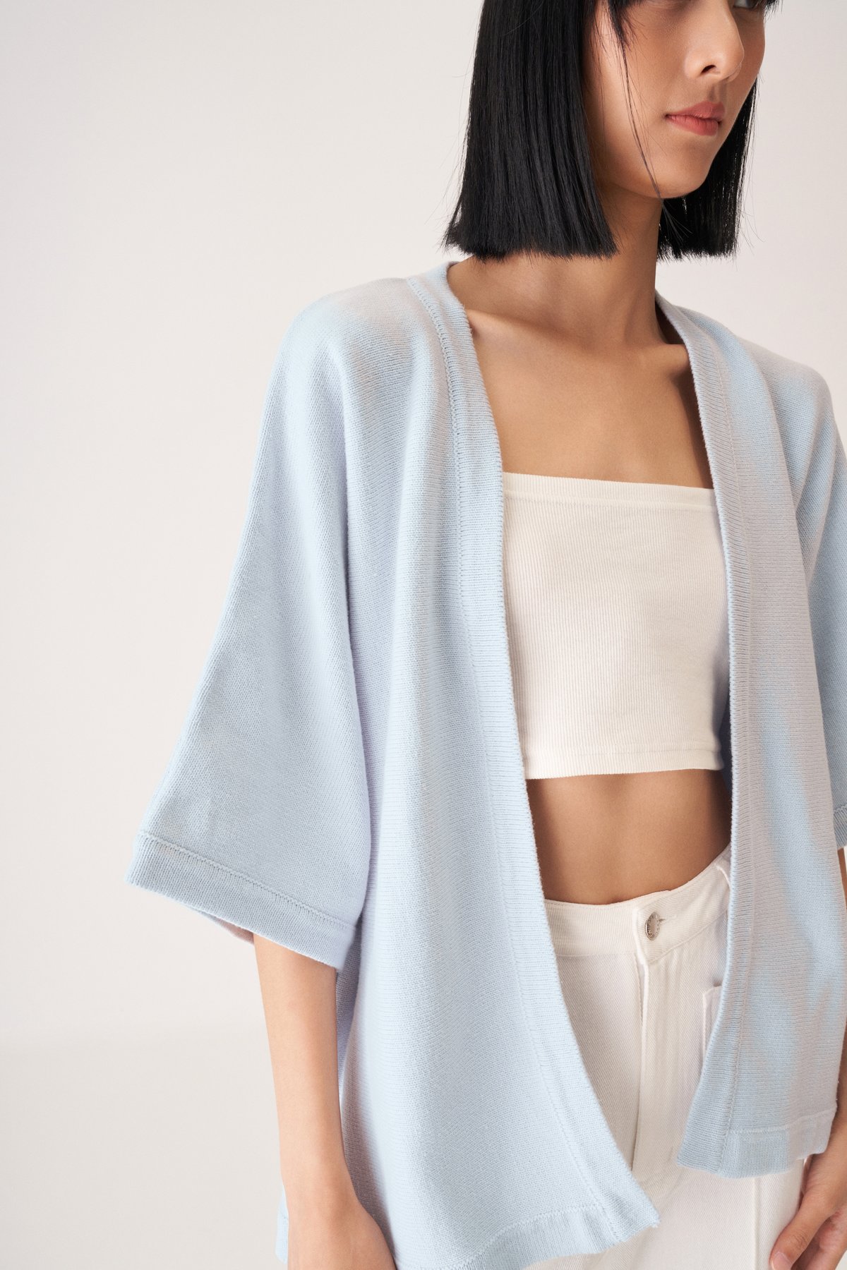 https://dum76bmz7do3s.cloudfront.net/sites/files/theclosetlover/images/products/202307/1200xAUTO/tavia_knit_kimono_in_sky_blue-4.jpg